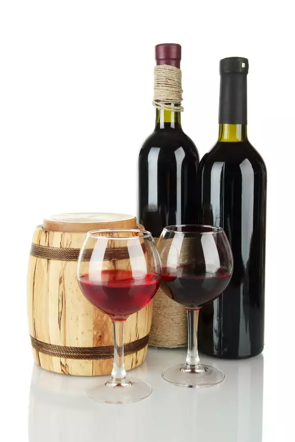 Red wine with wooden barrel isolated on white Red wine with wooden barrel isolated on white